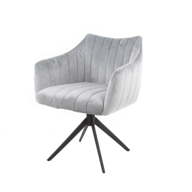 Détail du revêtement en velours et de la structure pivotante du fauteuil
