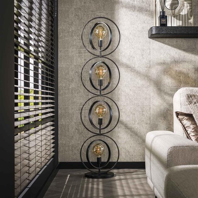Lampadaire salon industriel avec cercles extérieurs fixes et rotatifs.
