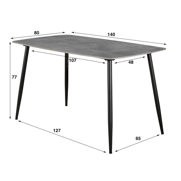 Vue latérale de la table céramique 140 cm dans un petit espace.