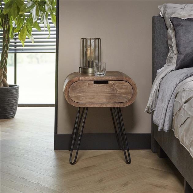 Table de chevet ronde moderne dans une chambre contemporaine